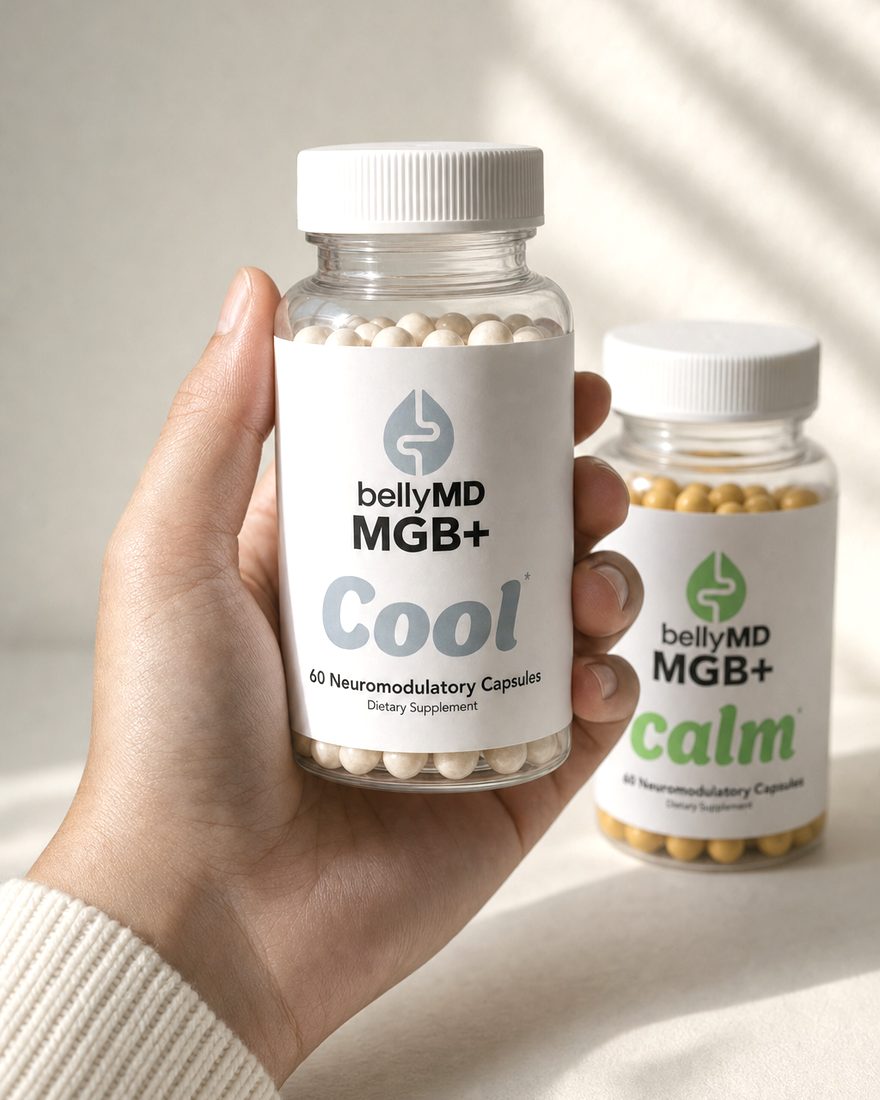 MGB+ Cool held in a hand with MGB+ Calm behind, for scale