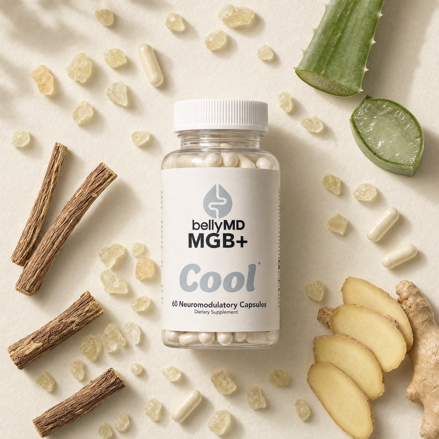MGB+ Cool bottle on cream paper with mastic resin crystals, licorice root, aloe, ginger, and cream capsules arranged around it